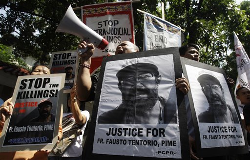 Filipino protests in Manila demanding justice for killing of Italian priest Fausto Tentorio