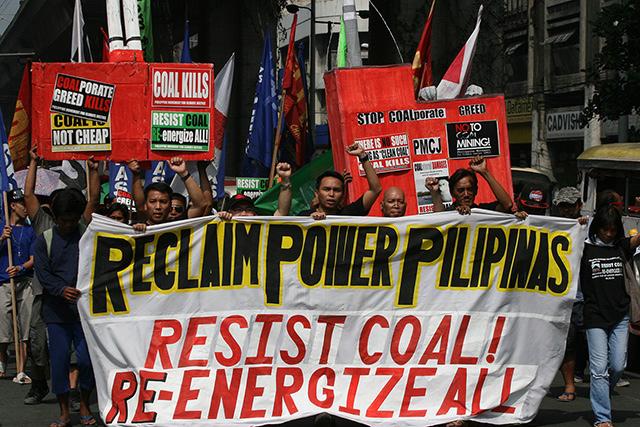 Residents of coal-affected communities march to Mendiola on Tuesday, 22 October 2013
