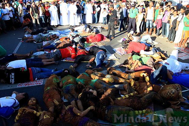 Lie down protest in front of government mining offices, Surigao City, on Earth Day 2013